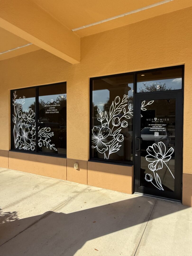 Orange storefront with white floral window decals