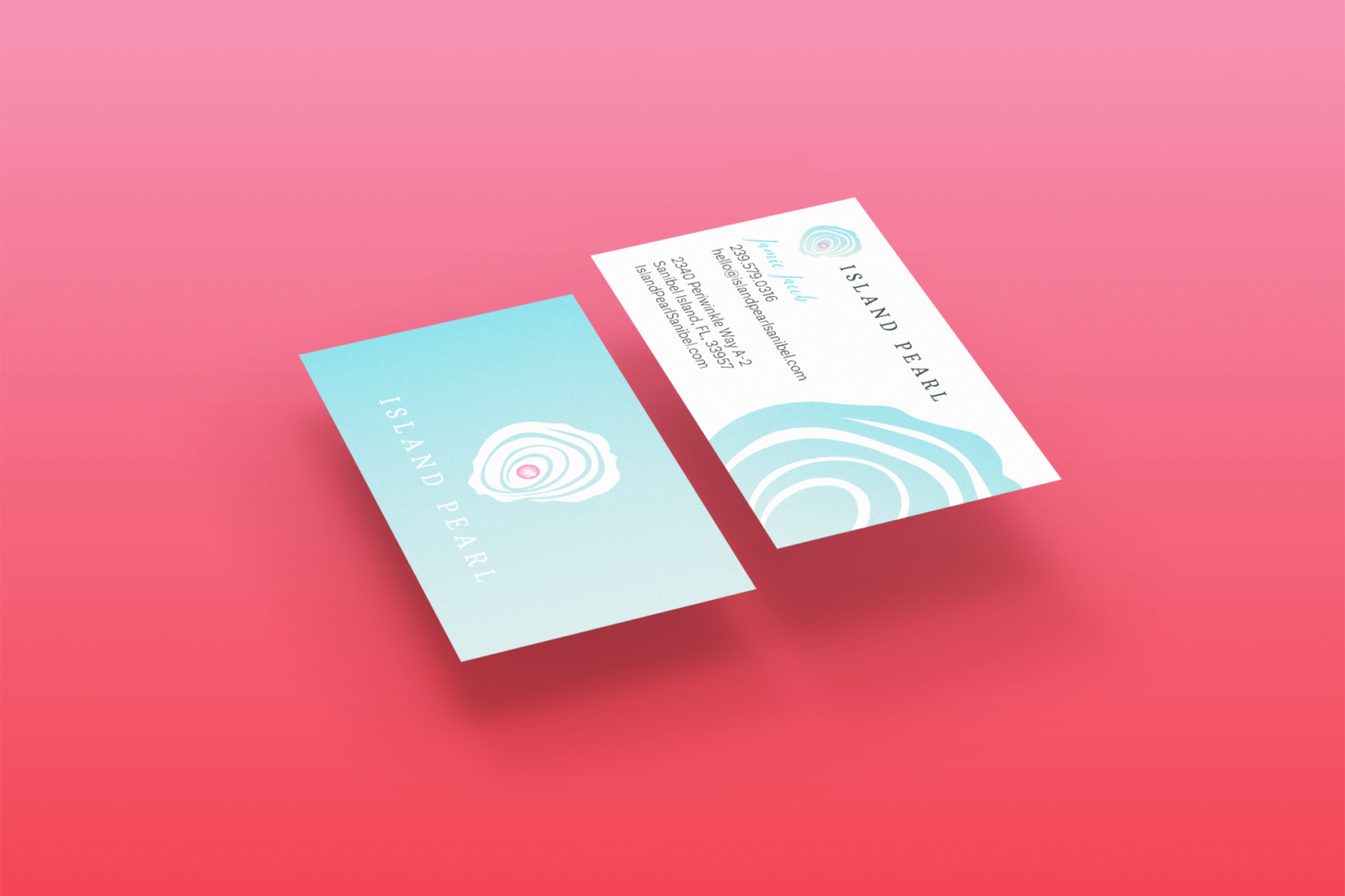 Two floating turquoise Island Pearl business cards