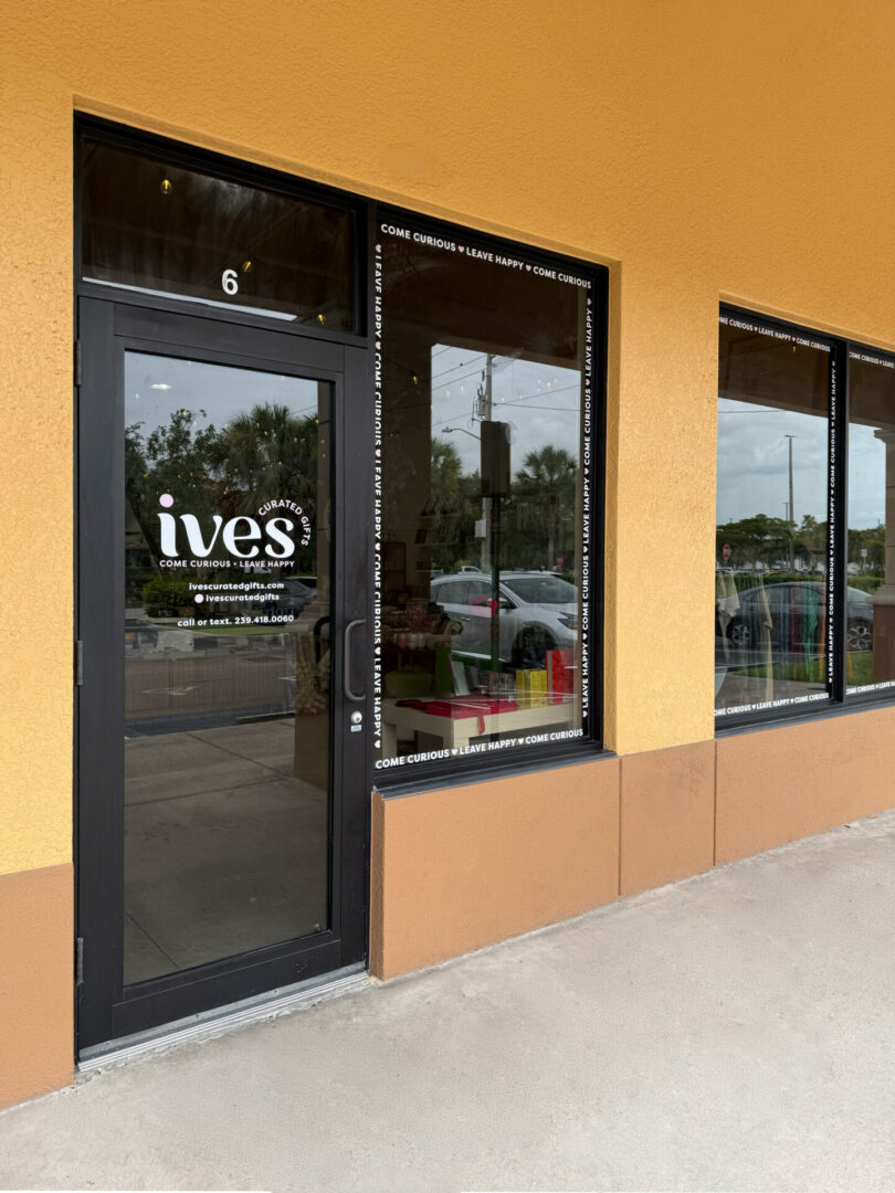 Ives storefront with glass door and windows