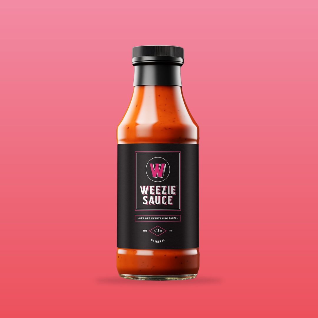 Weezie Sauce bottle on pink background